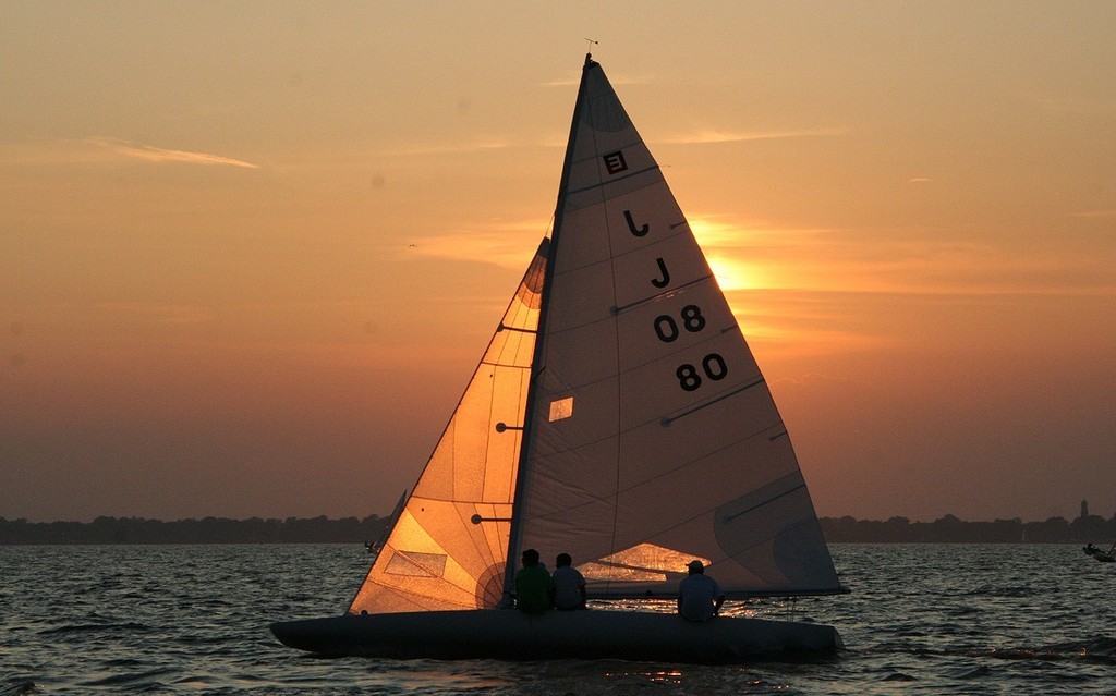E-scow sails past the sun -8223 - 2009 E Scow Nationals hosted by the Oshkosh Yacht Club © Tammy L Sawyer http://www.tammysawyer.com